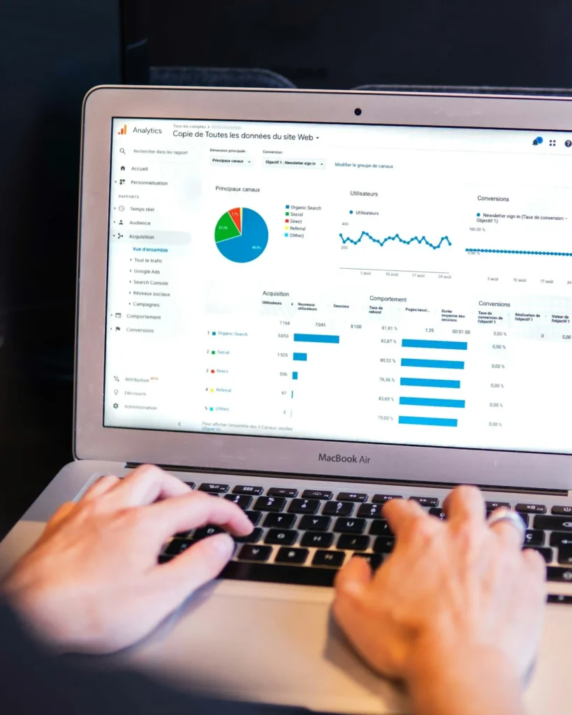 Reviewing website analytics on a laptop